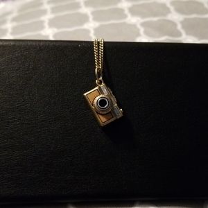 Brass camera charm and chain.
